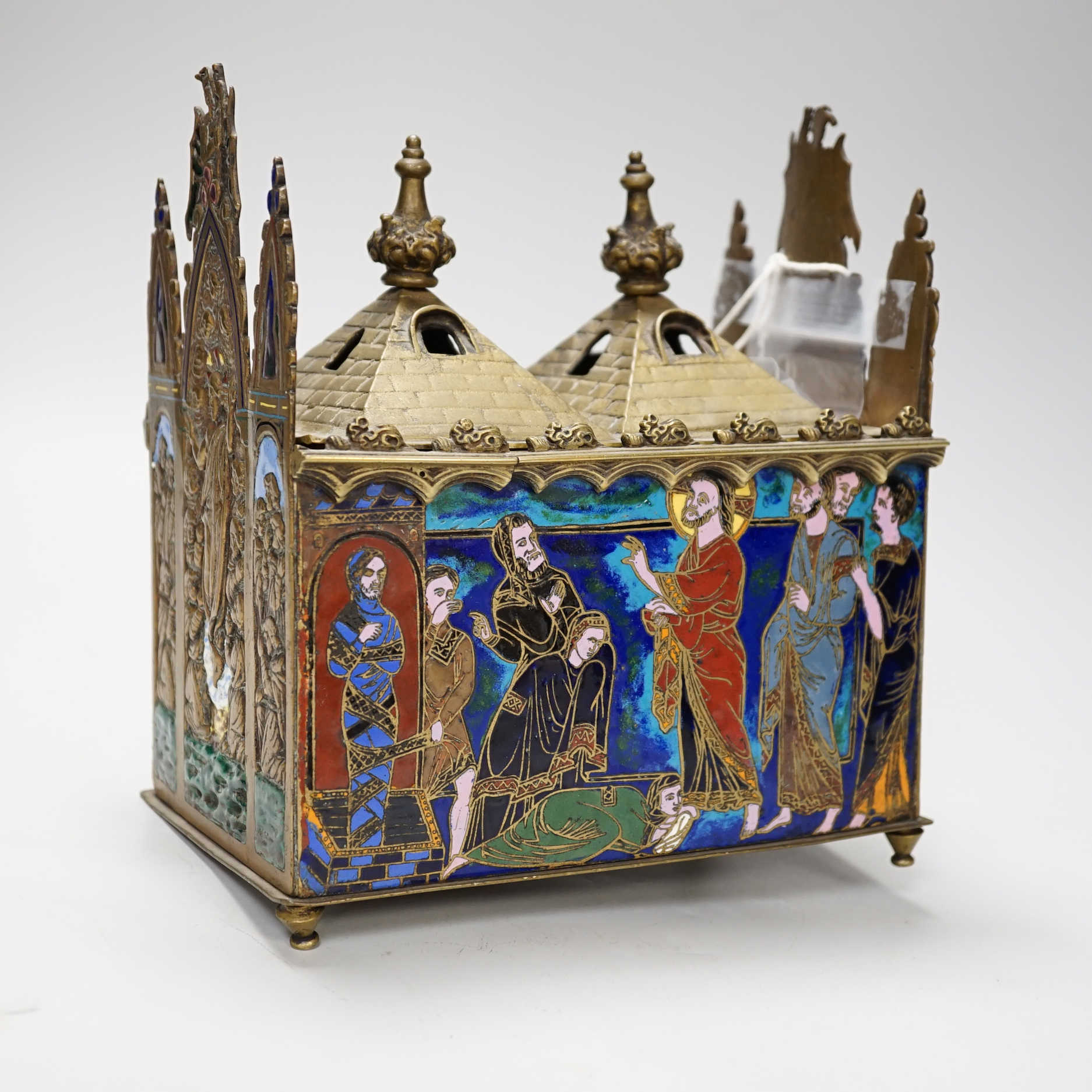A late 19th century replica of a medieval brass and champleve enamel reliquary casket, 21.5cm high x 19cm wide